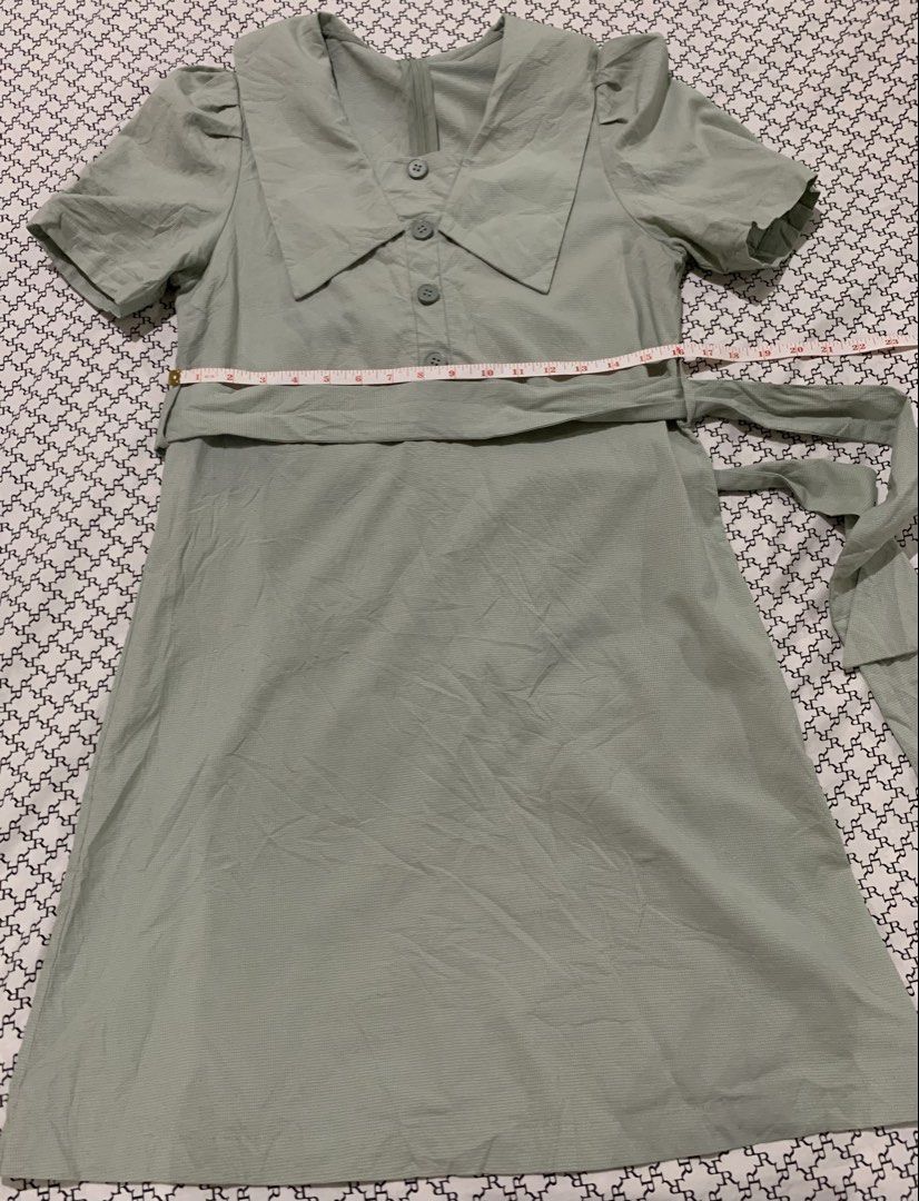 Light Blue Peter Pan Collar Button Up Dress with Belt (Category: Dresses) located in Paranaque City. Submitted by vbvessentials (Listing ID 1452829309, Image 2). Description: - Adorable light green dress - Features a charming Peter Pan collar - Button details down the front - Comes with a matching belt to cinch the waist - Short, cute puff sleeves - Ideal for casual days or picnics - Measurements: Chest 32-34 inches, Length 34 inches -ideal for p