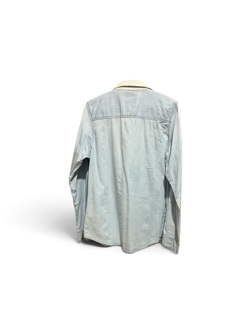 Light Wash Denim Shirt with Cream Panel (Category: Coats, Jackets and Outerwear) located in Antipolo. Submitted by joyeduarte175 (Listing ID 1452788739, Image 2). Description: - Long-sleeved denim shirt - Light blue wash - Cream-colored vertical panel down the front - Button-up closure - Lighter shade collar - Casual, everyday style - Great for layering or wearing solo.