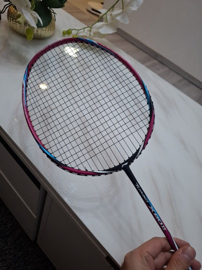 Lining Racket (Category: Racket & Ball Sports) located in Singapore. Submitted by tims_property (Listing ID 1452808970, Image 2). Description: Lining Turbo X 80ii. Strung with BG66 Ultimax @ 26lbs. 3U balanced (but i think slightly head heavy). Very very minimal scratch. welcomed to inspect before dealing. Will throw you 1 racket cover and 1 new grip..