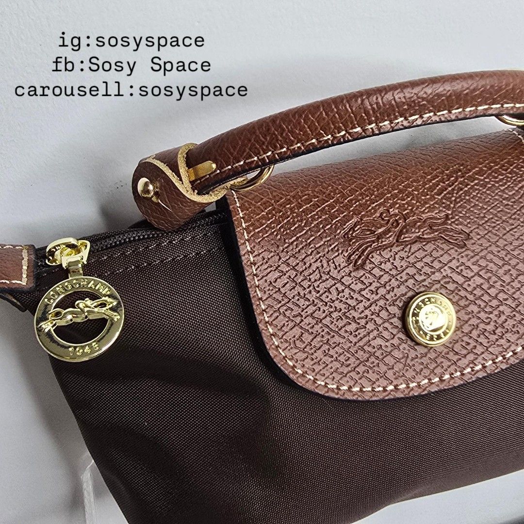 Longchamp Le Pliage Original Pouch With Handle And Sling Strap (Category: Luxury Bags & Wallets) located in Lucena. Submitted by sosyspace (Listing ID 1452780612, Image 3). Description: L. O. N. G. C. H. A. M. P. 03B2P77 Le Pliage Pouch w/ Handle and Sling Strap 34175919P81 6.7 x 2.2 x 4.3 inches Recycled Polyamide Canvas W/ Inside Coating Russian Cowhide Leather Gold Hardware Snap Button and Zip Closure France Condition: Brand New Final Price: P