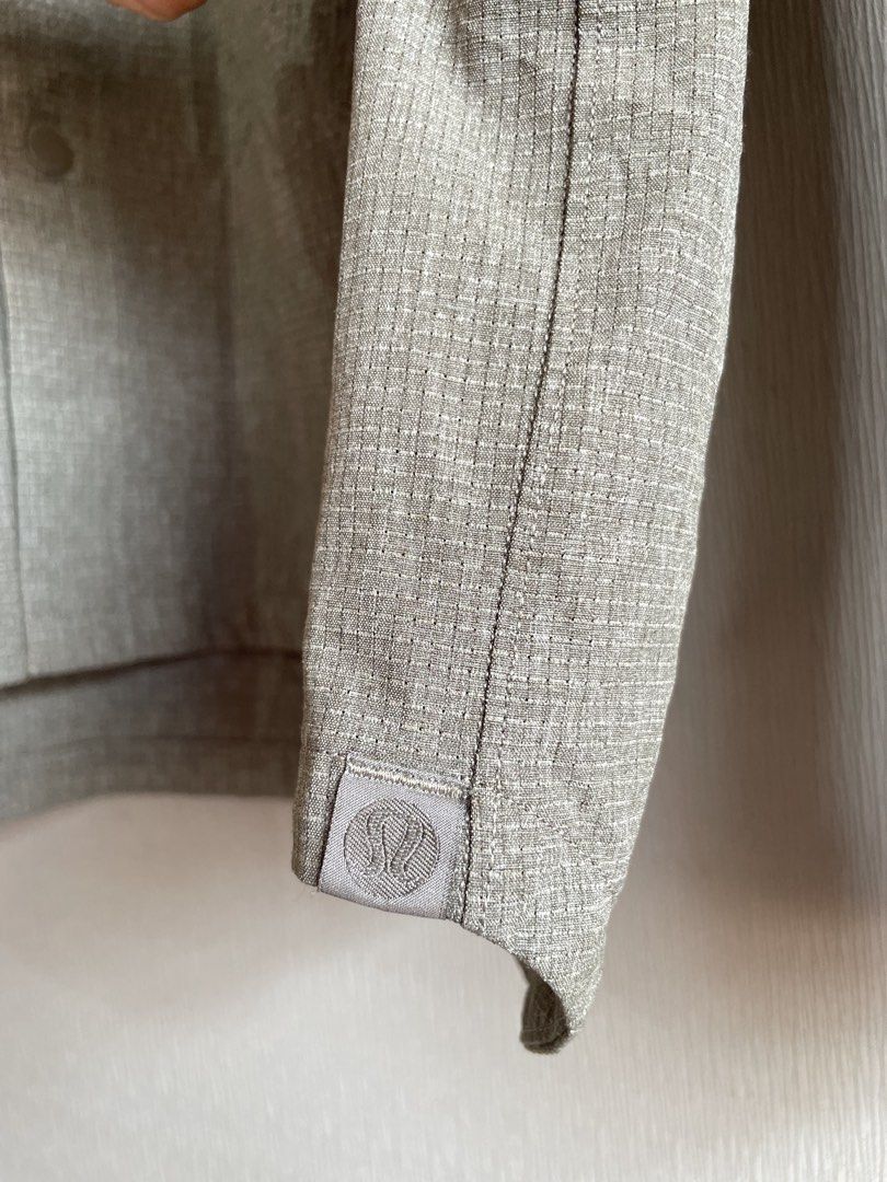 Lululemon Button-Up Shirt Grey Textured Long Sleeve (Category: Tshirts & Polo Shirts ) located in Mataasnakahoy. Submitted by zero4thrift (Listing ID 1452748651, Image 2). Description: - Grey Lululemon button-up shirt - Textured fabric throughout - Two chest pockets with button closures - Long sleeves with button cuffs - Simple and versatile design - Perfect for layering or wearing on its own Actual size - 22” width - 28” length 📌 DISCLAIMER 📍P