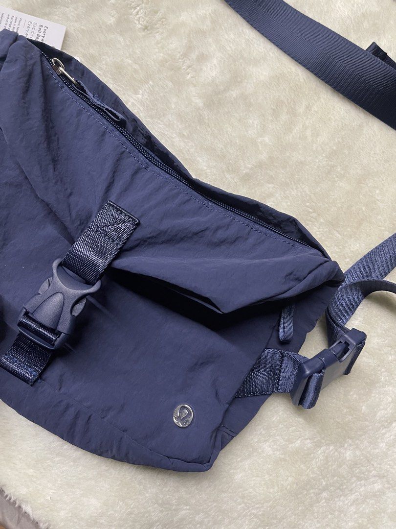 Lululemon Everywhere Belt Bag Navy Blue (Category: Cross-body Bags) located in Baguio. Submitted by randomly2600 (Listing ID 1452813111, Image 1). Description: - Navy blue Lululemon Everywhere Belt Bag - Water-resistant fabric - Adjustable strap with buckle closure - Zippered main compartment - Back zippered pocket - Small Lululemon logo on front - Ideal for everyday use or travel.