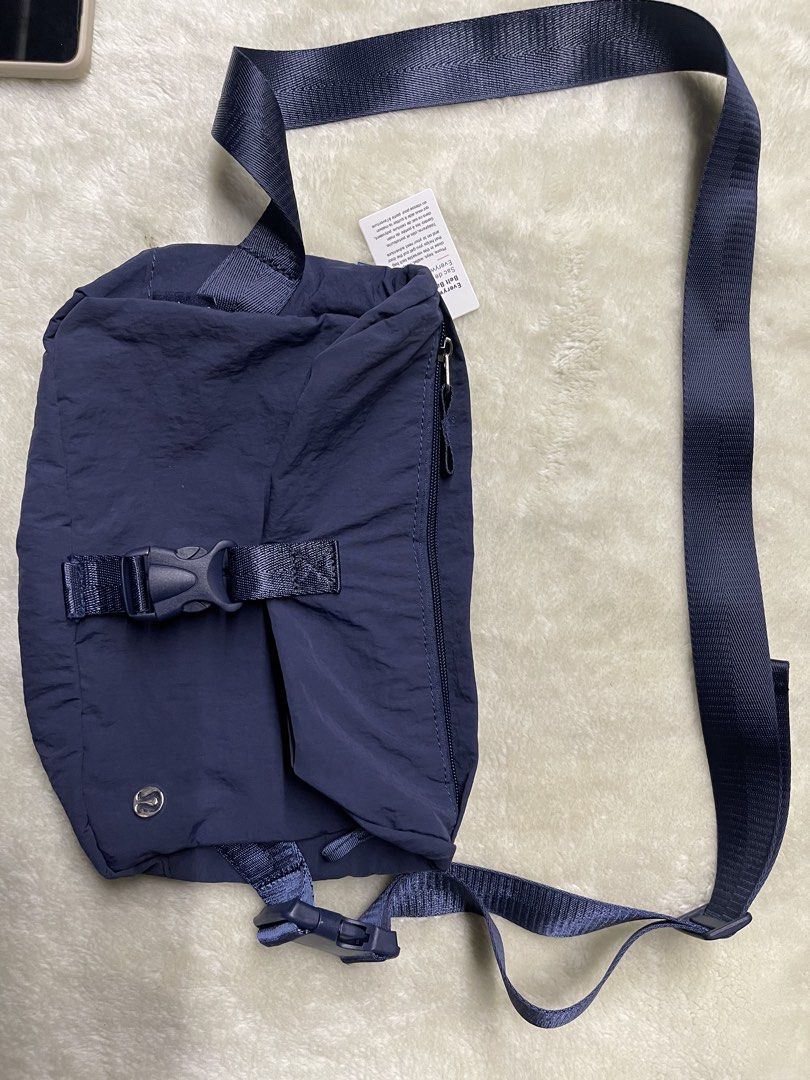 Lululemon Everywhere Belt Bag Navy Blue (Category: Cross-body Bags) located in Baguio. Submitted by randomly2600 (Listing ID 1452813111, Image 2). Description: - Navy blue Lululemon Everywhere Belt Bag - Water-resistant fabric - Adjustable strap with buckle closure - Zippered main compartment - Back zippered pocket - Small Lululemon logo on front - Ideal for everyday use or travel.
