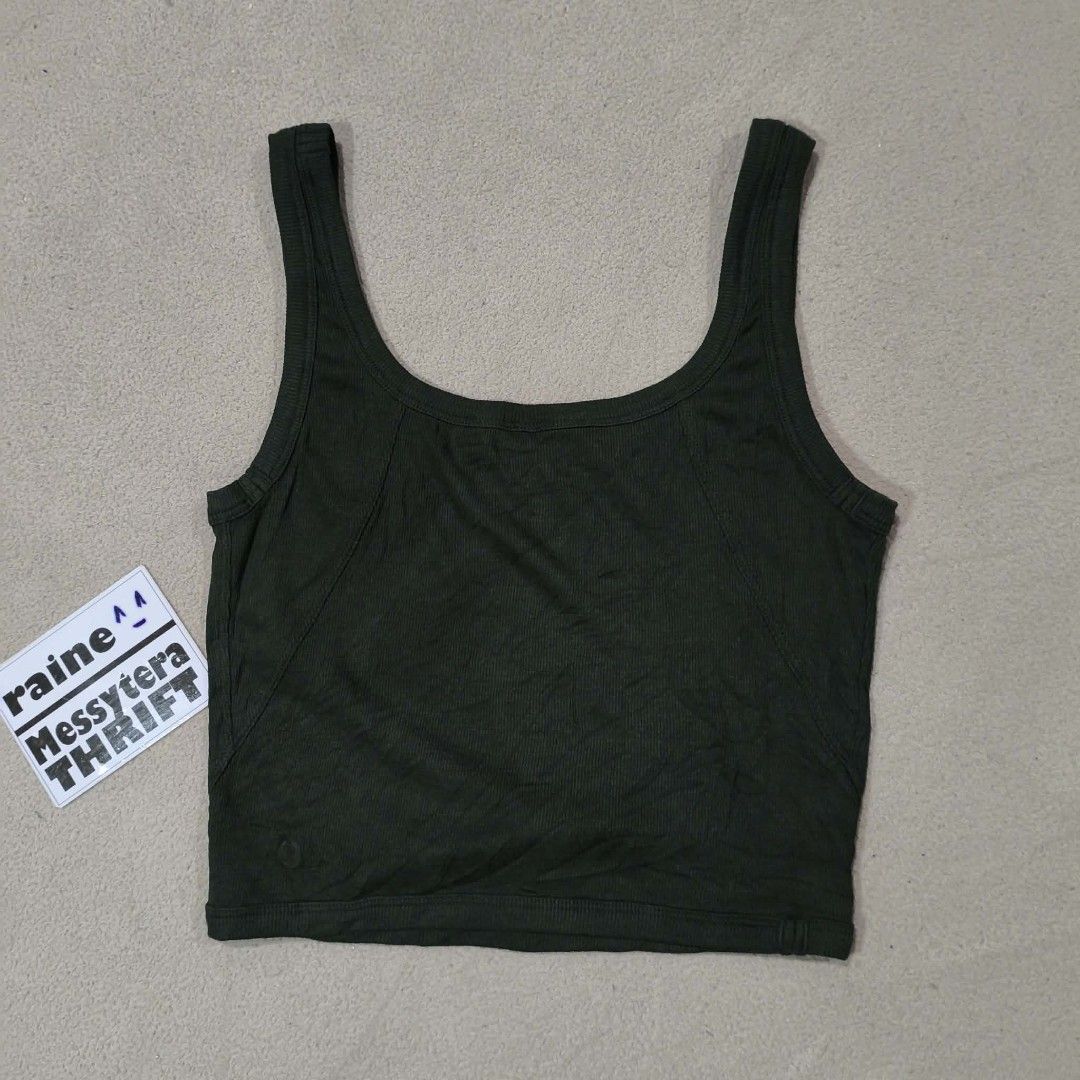 Lululemon (smooth & rib knit crop tank top) (Category: Sleeveless) located in Calatrava. Submitted by messytera9 (Listing ID 1452816511, Image 2). Description: Lululemon (smooth & rib knit crop tank top) in dark moss green Excellent condi No tags, logo only Can fit small frame( stretchy) W: 13" L: 16".
