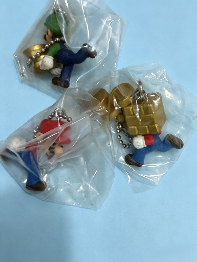 Mario & Luigi Keychain Charms (Category: Character Goods) located in Cebu City. Submitted by jessacelo30916 (Listing ID 1452842156, Image 1). Description: - Set of 3 Mario and Luigi keychain charms - Features characters in classic outfits - Each charm includes a metal ball chain - Ideal for decorating bags or keys - A must-have for Super Mario fans.