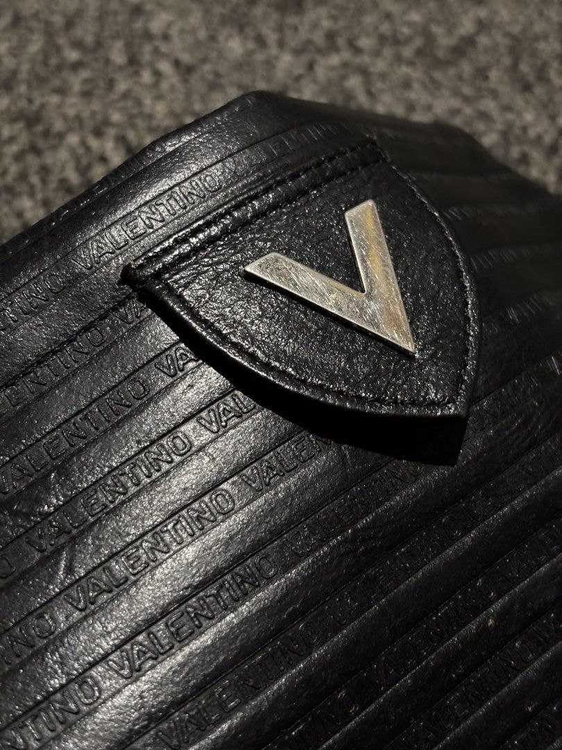 Mario Valentino Clutch Bag Embossed Logo (Category: Clutches) located in Bulacan. Submitted by thriftstarph (Listing ID 1452790709, Image 3). Description: PLEASE READ THE DESCRIPTION BELOW‼️ Mario Valentino Clutch Bag Embossed Logo Iconic V Logo From: Japan No Box Issue: Minor Flaws NEGOTIABLE .