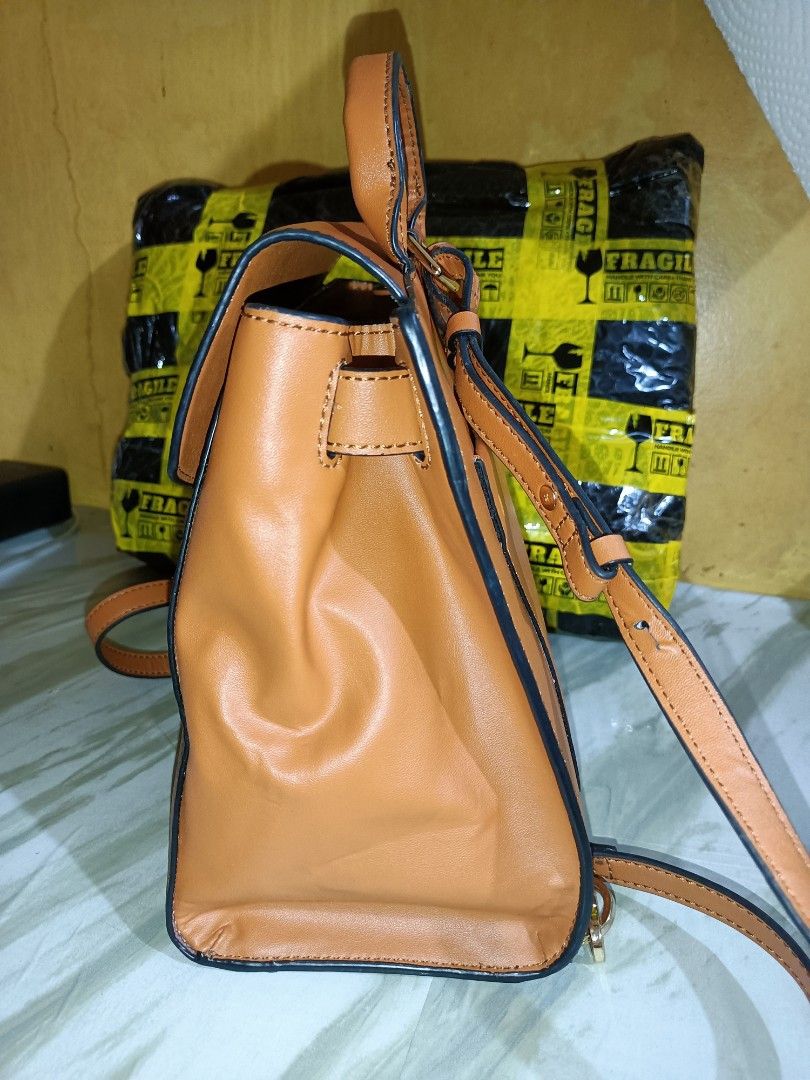 MCM Essential Visetos Small Backpack (Category: Luxury Bags & Wallets) located in Bolinao. Submitted by shayne_0215 (Listing ID 1452755020, Image 2). Description: - Authentic MCM - Tan leather backpack with iconic MCM monogram print. - Comfortable top handle and adjustable shoulder straps. - Secure front flap closure with stylish buckle detail. - Convenient back pocket for quick access. - Ideal for everyday adventures and stylish commutes - Made 