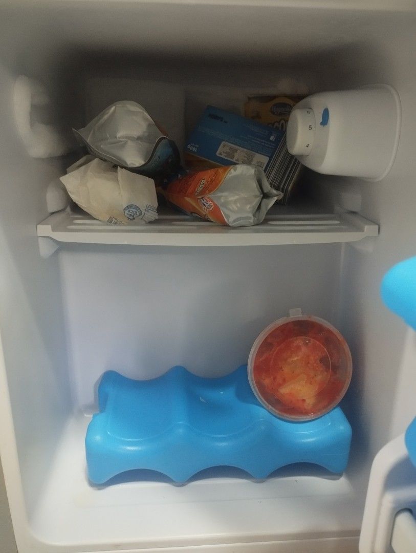 Mini Fridge Freezer Combo (Category: Refrigerators and Freezers) located in Manila. Submitted by zeus025 (Listing ID 1452738972, Image 3). Description: - Compact mini fridge with a top freezer compartment. - Ideal for dorm rooms, offices, or any small space. - Keeps beverages and snacks perfectly chilled. - Freezer section is great for ice cream and frozen goods. - Sleek silver exterior. - In excellent working condition..