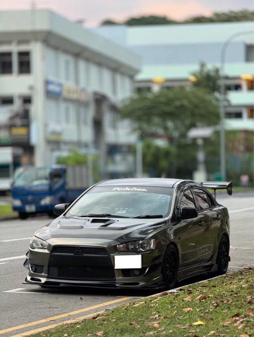 Mitsubishi Lancer EX 1.5 (A) (Category: Used Cars) located in Singapore. Submitted by yeeaabooii (Listing ID 1452801286, Image 2). Description: Renewable 10 years Accessories - HKS exhaust with cert - Voltex Type 2 GT Wing - Air speed air Intake - Defi Gauge - Throttle Controller - Android player - Carbon Steering.
