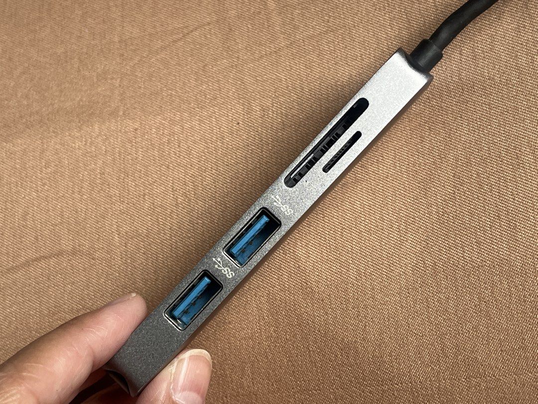 MOKIN USB-C Adapter Hub with HDMI, USB 3.0, SD Card Reader (Category: Cables & Adaptors) located in General Trias. Submitted by levelupclothingapparel (Listing ID 1452699201, Image 2). Description: - MOKIN USB-C Hub (Model H1505) - Expands laptop connectivity via USB-C - Includes: 1 HDMI port, 2 USB 3.0 ports, 1 SD card reader - Perfect for multitasking and connecting peripherals.