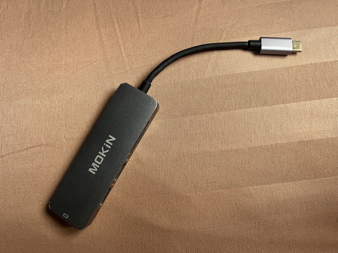 MOKIN USB-C Adapter Hub with HDMI, USB 3.0, SD Card Reader (Category: Cables & Adaptors) located in General Trias. Submitted by levelupclothingapparel (Listing ID 1452699201, Image 1). Description: - MOKIN USB-C Hub (Model H1505) - Expands laptop connectivity via USB-C - Includes: 1 HDMI port, 2 USB 3.0 ports, 1 SD card reader - Perfect for multitasking and connecting peripherals.