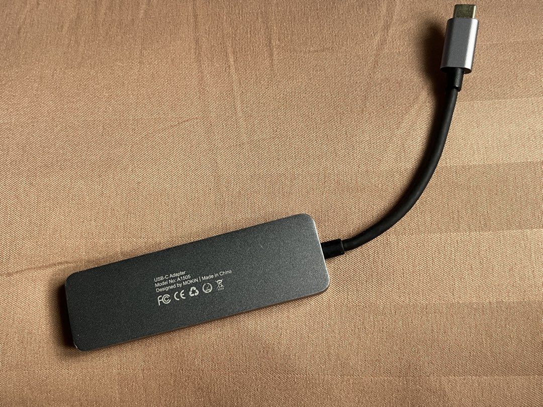 MOKIN USB-C Adapter Hub with HDMI, USB 3.0, SD Card Reader (Category: Cables & Adaptors) located in General Trias. Submitted by levelupclothingapparel (Listing ID 1452699201, Image 3). Description: - MOKIN USB-C Hub (Model H1505) - Expands laptop connectivity via USB-C - Includes: 1 HDMI port, 2 USB 3.0 ports, 1 SD card reader - Perfect for multitasking and connecting peripherals.