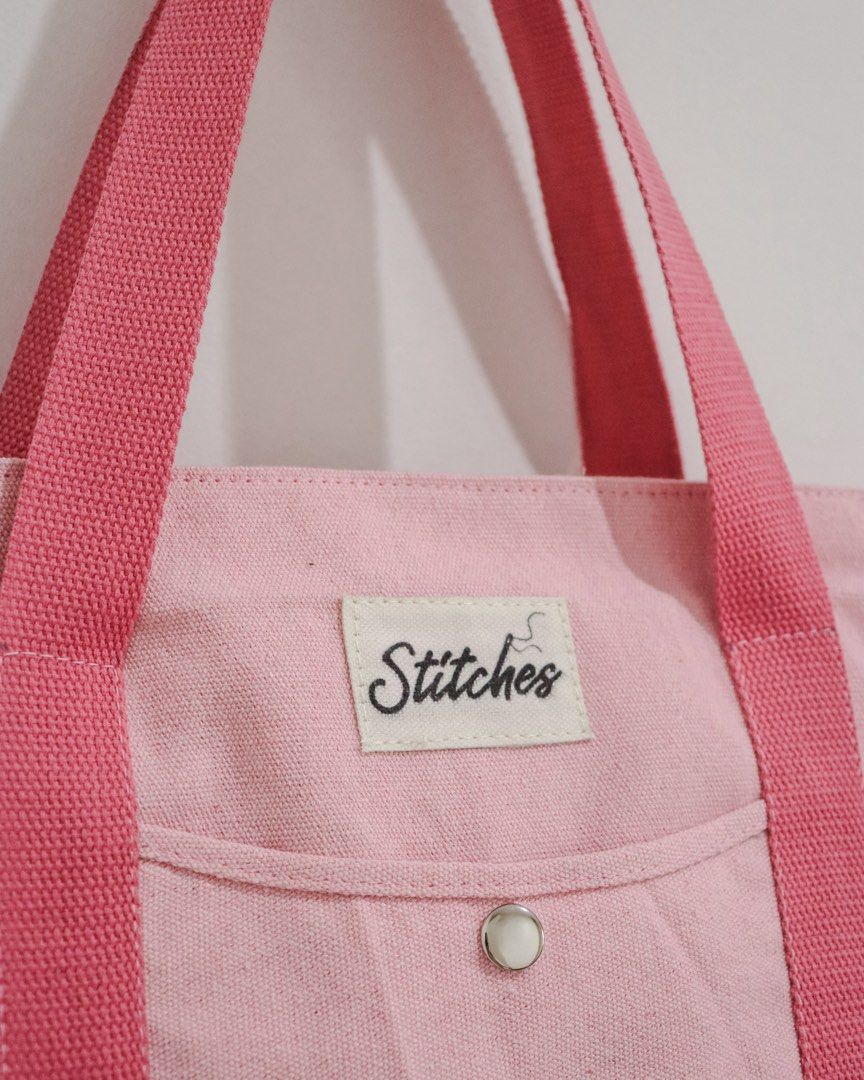 Multi-Pocket Heavy Duty Canvas Tote Bag (Category: Tote Bags) located in Marikina City. Submitted by hellolei_c (Listing ID 1452814221, Image 2). Description: Material: Heavy-duty, thick canvas fabric for long-lasting durability. Main Closure: Top zip closure to keep your items safe and secure. Exterior Pockets: **Front quick-access slip pocket with a secure metal snap button closure **2 Deep side pockets (ideal for water bottles, umbrellas, or p