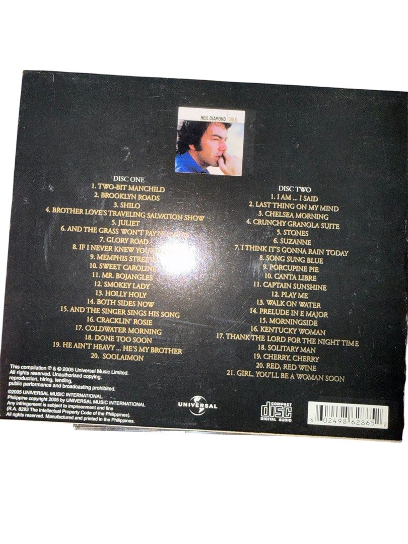 Neil Diamond Gold 2CD Compilation Album (Category: CDs & DVDs) located in Quezon City. Submitted by Decluttererqc (Listing ID 1452737195, Image 3). Description: - Neil Diamond Gold 2CD Compilation - Includes hits: 'Sweet Caroline', 'Cracklin' Rosie', and more! - Mastered in high-resolution 96k/24-bit audio - Perfect collection for any Neil Diamond fan.