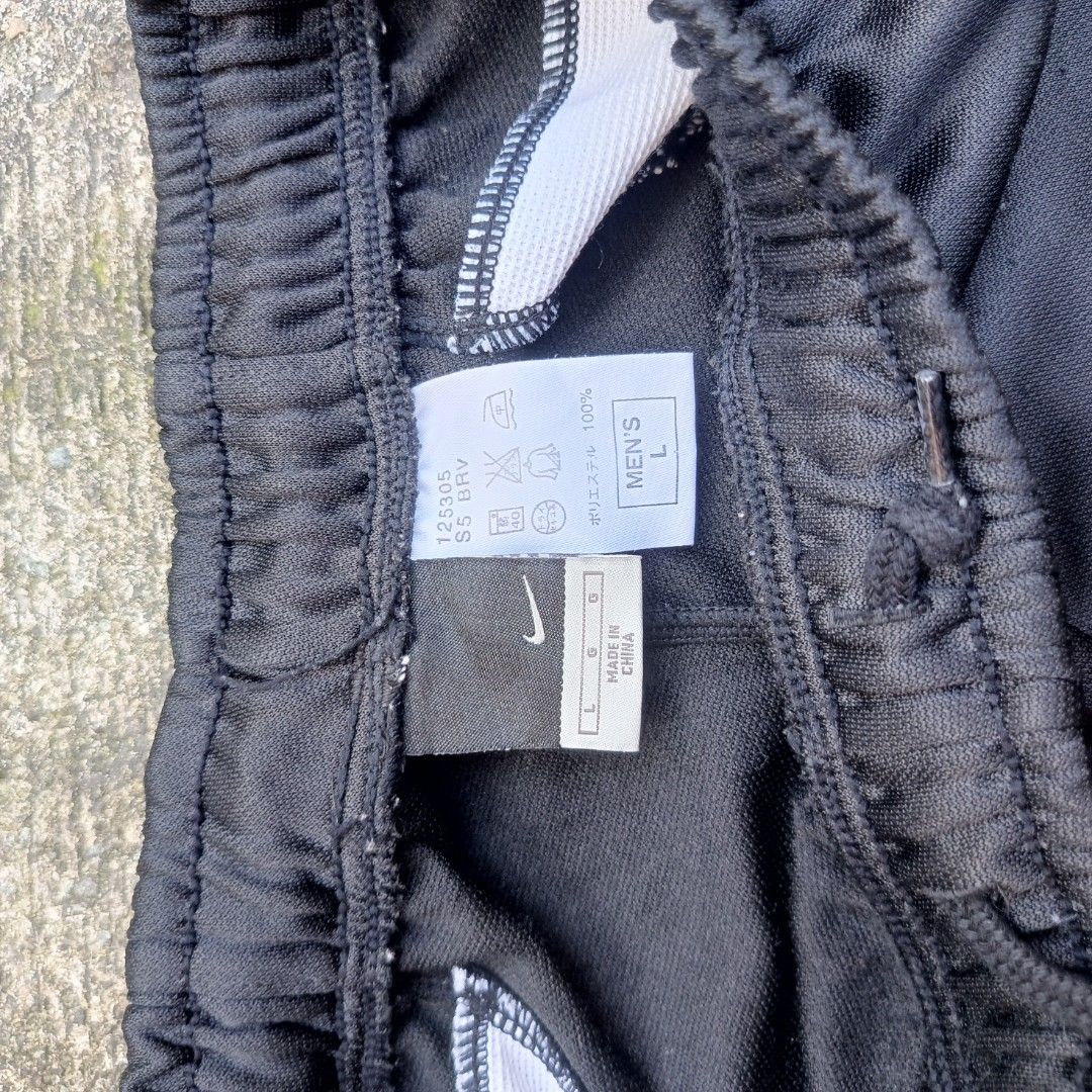 Nike DIMES Width-free Garterize Pants L Black (Category: Joggers) located in Caloocan City. Submitted by abadinasjo52338 (Listing ID 1452790699, Image 3). Description: - Black Nike pants - Size L - Garterized waist with drawstring - White piping along the sides - Two front pockets, two back pockets - Zippers at the ankle - Made of polyester.