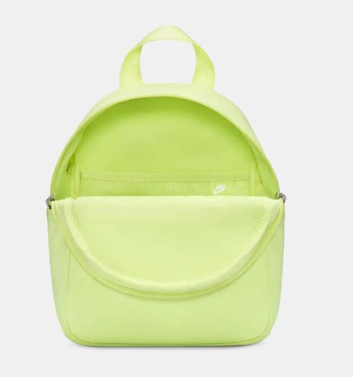 Nike Light Lemon Twist Mini Backpack (Category: Backpacks) located in Davao. Submitted by jilly07 (Listing ID 1452782186, Image 2). Description: - Light lemon twist Nike mini backpack - Front zip pocket for quick access - Main compartment with an internal mesh pocket - Adjustable shoulder straps for a comfortable fit - Ideal for carrying your essentials - Adds a vibrant pop of color to any outfit BRAND NEW WITH TAGS Bought in Nike Store RFS: decl