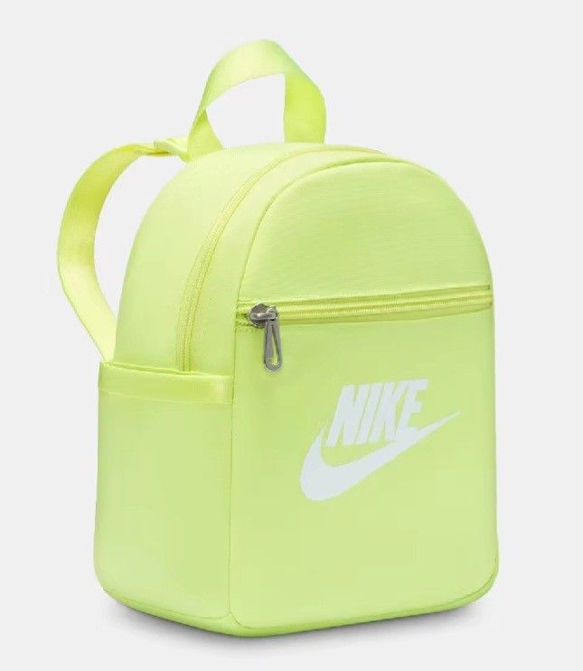 Nike Light Lemon Twist Mini Backpack (Category: Backpacks) located in Davao. Submitted by jilly07 (Listing ID 1452782186, Image 3). Description: - Light lemon twist Nike mini backpack - Front zip pocket for quick access - Main compartment with an internal mesh pocket - Adjustable shoulder straps for a comfortable fit - Ideal for carrying your essentials - Adds a vibrant pop of color to any outfit BRAND NEW WITH TAGS Bought in Nike Store RFS: decl