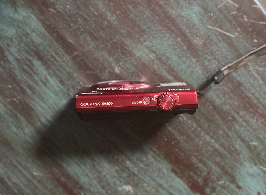 Nikon Coolpix S6100 in Red (Category: Cameras) located in Manila. Submitted by bellopapoi (Listing ID 1452827806, Image 3). Description: Nikon Coolpix S6100 in Red 🍒📷 Features: ⭐️ 16 MP Sensor ⭐️ 7x Optical Zoom Lens (28-196mm) ⭐️ 3.0-inch Touchscreen LCD ⭐️ 720p HD Video Recording Inclusions: ⭐️ Camera ⭐️ Battery ⭐️ Pouch ⭐️ Strap Condition: ⭐️ Issues: mild screen burn & unnoticeable dust when zoomed (all issues do not affect the output) ⭐️ Fu
