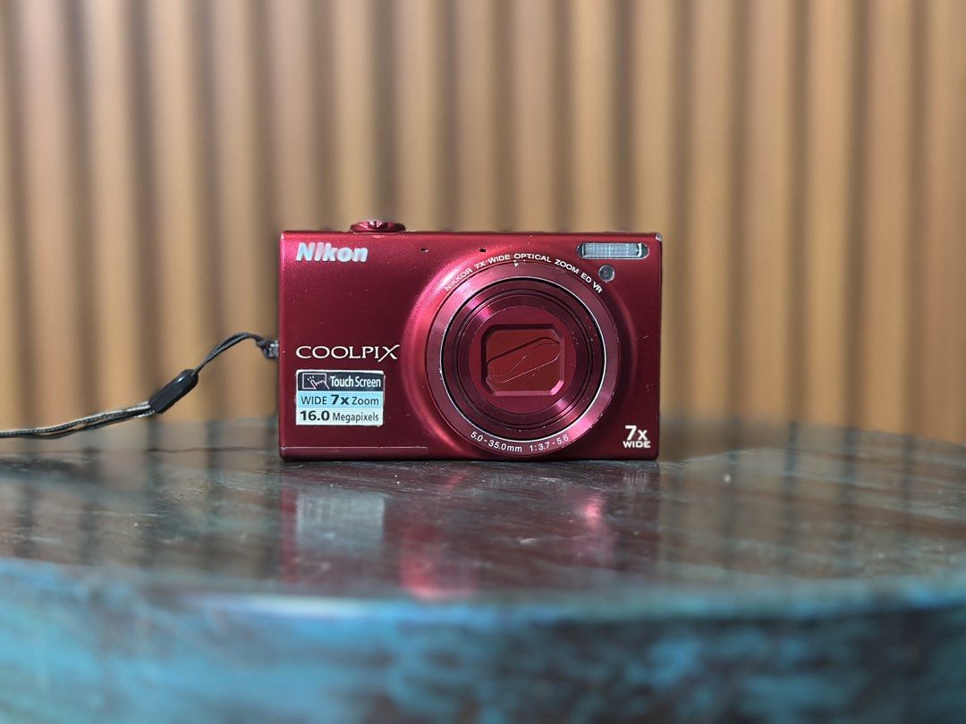 Nikon Coolpix S6100 in Red (Category: Cameras) located in Manila. Submitted by bellopapoi (Listing ID 1452827806, Image 1). Description: Nikon Coolpix S6100 in Red 🍒📷 Features: ⭐️ 16 MP Sensor ⭐️ 7x Optical Zoom Lens (28-196mm) ⭐️ 3.0-inch Touchscreen LCD ⭐️ 720p HD Video Recording Inclusions: ⭐️ Camera ⭐️ Battery ⭐️ Pouch ⭐️ Strap Condition: ⭐️ Issues: mild screen burn & unnoticeable dust when zoomed (all issues do not affect the output) ⭐️ Fu