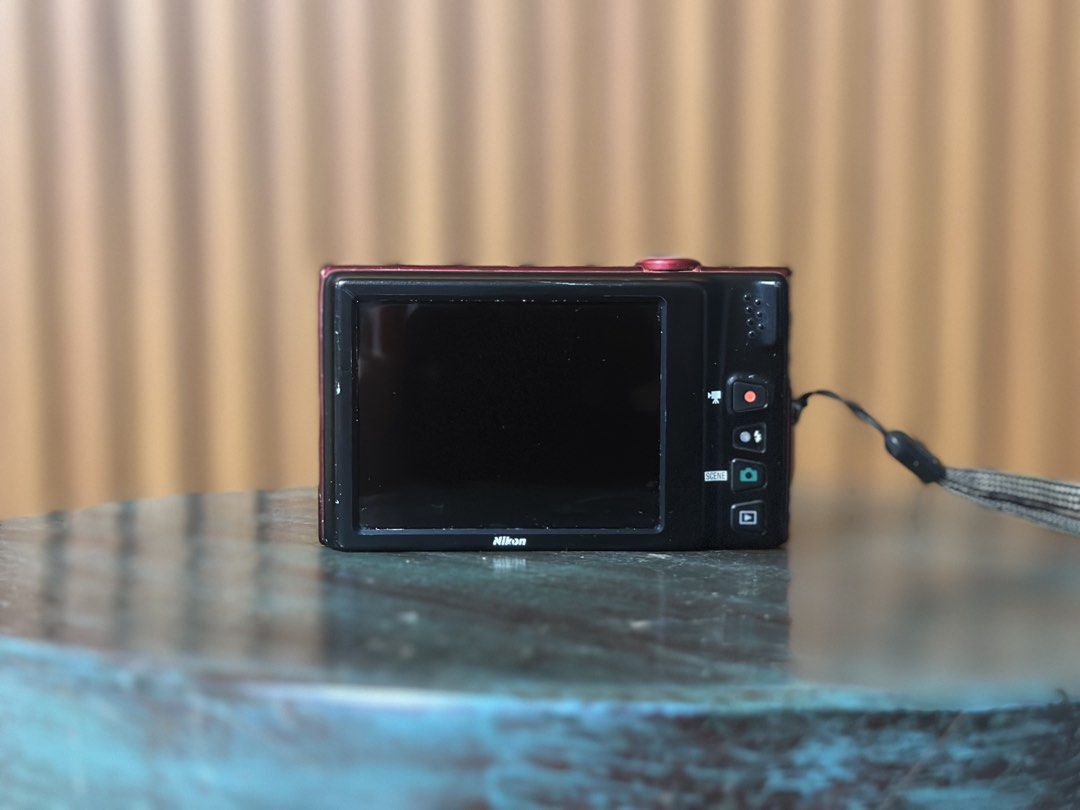 Nikon Coolpix S6100 in Red (Category: Cameras) located in Manila. Submitted by bellopapoi (Listing ID 1452827806, Image 2). Description: Nikon Coolpix S6100 in Red 🍒📷 Features: ⭐️ 16 MP Sensor ⭐️ 7x Optical Zoom Lens (28-196mm) ⭐️ 3.0-inch Touchscreen LCD ⭐️ 720p HD Video Recording Inclusions: ⭐️ Camera ⭐️ Battery ⭐️ Pouch ⭐️ Strap Condition: ⭐️ Issues: mild screen burn & unnoticeable dust when zoomed (all issues do not affect the output) ⭐️ Fu