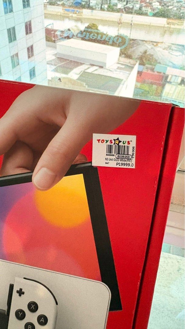 Nintendo Switch OLED Model White with Accessories (Category: Nintendo) located in Quezon City. Submitted by EMSLORENZO (Listing ID 1452764545, Image 3). Description: - Nintendo Switch OLED Model (White) - Includes original dock and Joy-Cons - All necessary charging cables included - Comes with Nacon protective travel case XL - Extra Joy-Con grips for enhanced comfort - Pre-applied screen protector for immediate use - Original packaging included -