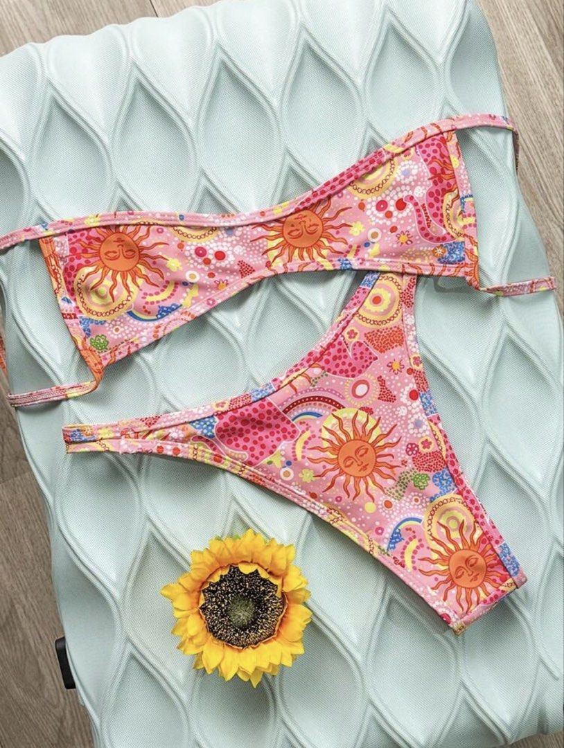 Pink Sun & Rainbow Print Bikini Set (Category: Bikinis & Swimsuits) located in Pasig City. Submitted by ag_cleanup (Listing ID 1452821561, Image 2). Description: NEVER USED. Does not fit me..