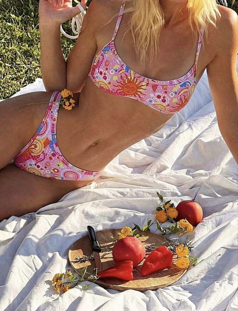 Pink Sun & Rainbow Print Bikini Set (Category: Bikinis & Swimsuits) located in Pasig City. Submitted by ag_cleanup (Listing ID 1452821561, Image 1). Description: NEVER USED. Does not fit me..