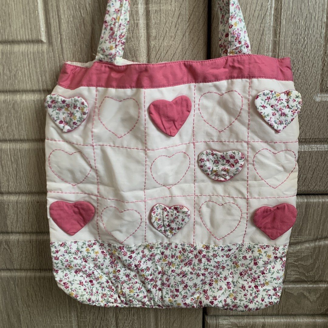 Pink Tote Bag (Category: Tote Bags) located in Calamba. Submitted by capriciousss (Listing ID 1452731672, Image 2). Description: pink tote bag with flowers and heart design soft material small cute bag perfect for picnics, dates, outfits or errands 11.5"x11.5" Rfs: decluttering make an offer if interested.
