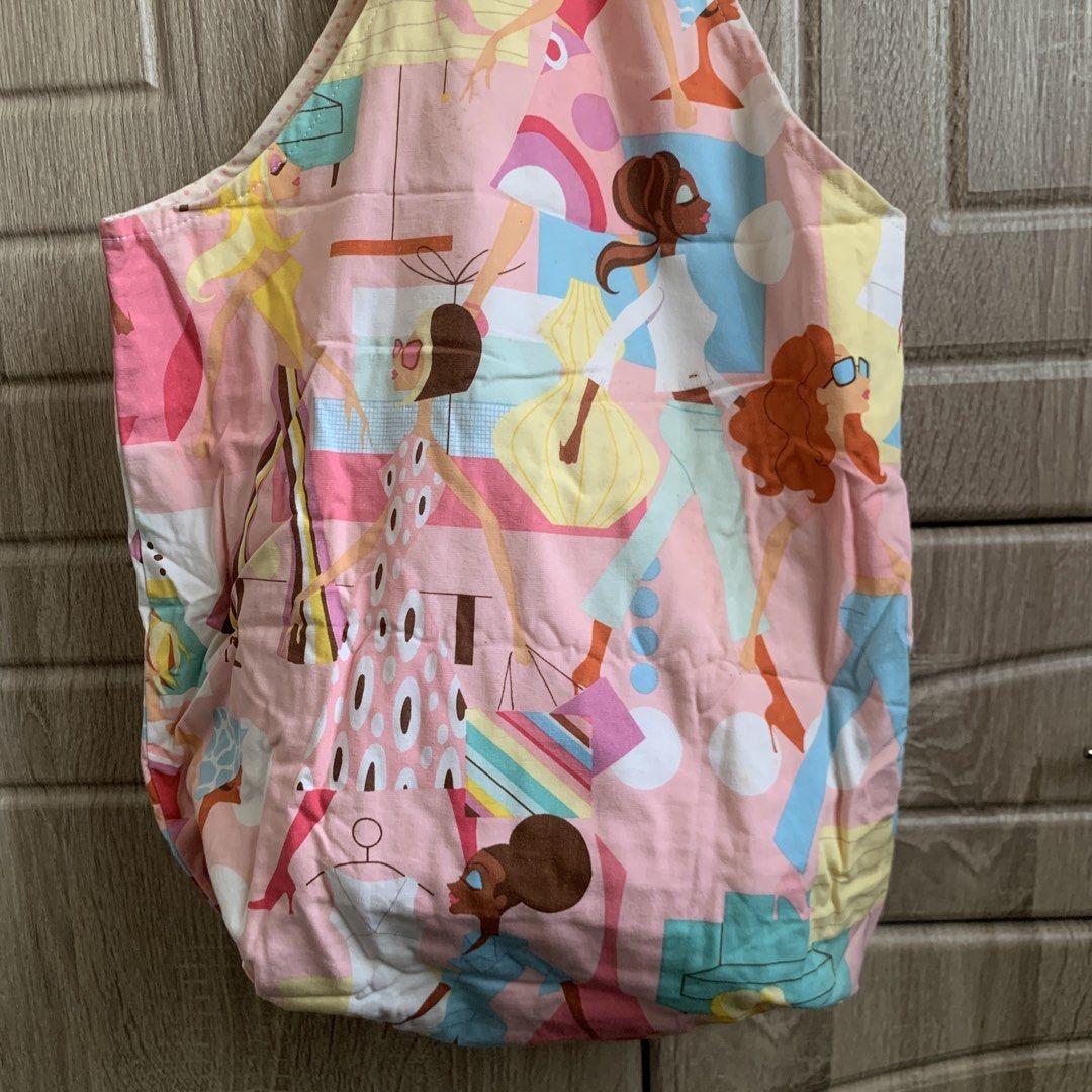 Pink Tote Bag (Category: Tote Bags) located in Calamba. Submitted by capriciousss (Listing ID 1452732757, Image 3). Description: pink cute tote bag reversible: one side has prints of women, the other has polka dots design spacious, good for grocery errands with pockets on the polka dots side 13.5"x12" (handle is about 12") needs cleaning Rfs: decluttering make an offer if interested.