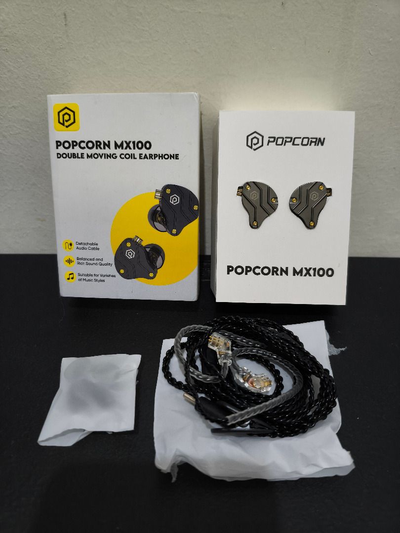 Popcorn MX100 IEM (Category: Earphones) located in Muntinlupa City. Submitted by poggleswood (Listing ID 1452828329, Image 1). Description: In‑ear monitors with balanced tuning — clean mids and pleasant bass. Key Features - Comfortable ergonomic shells for long listening sessions - Detachable 2‑pin cable - Fully functional — no issues with drivers, channels, or connectors Condition & Inclusions - Condition: Lightly used - Inclusions: Original box