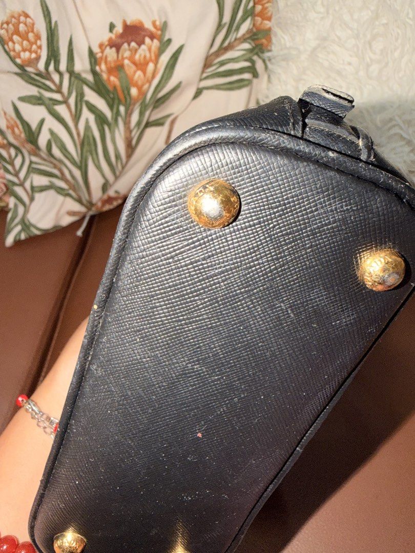 Prada (Category: Luxury Bags & Wallets) located in Mati. Submitted by michjake1009 (Listing ID 1452835760, Image 3). Description: In very good condition missing 1 puller sa isang zipper No sling strap With dustbag .