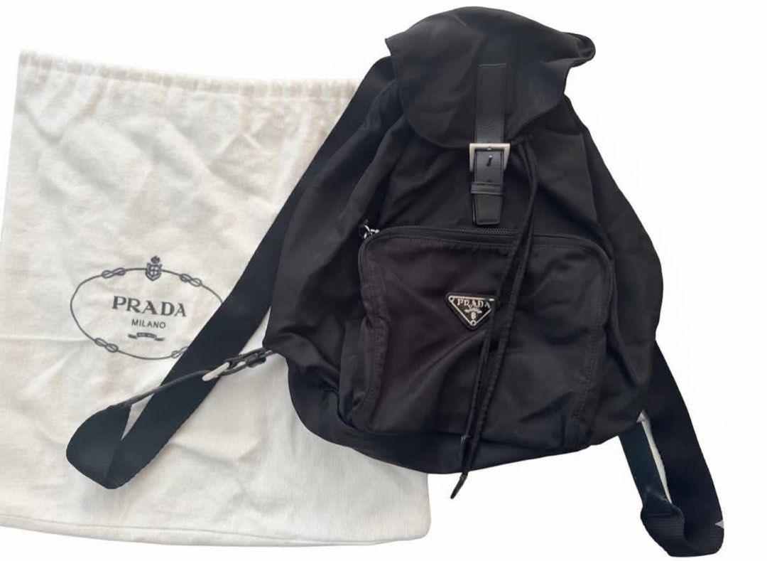 Prada Tessuto Nylon Backpack with Dust Bag (Category: Luxury Bags & Wallets) located in Cainta. Submitted by ginamit (Listing ID 1452701481, Image 1). Description: - Authentic Prada backpack - Black nylon material - Secure drawstring closure with buckle strap - Convenient front zip pocket - Includes original Prada dust bag - Ideal for everyday use or travel ***100% authentic. Full refund plus ₱5,000 if the item is confirmed counterfeit by the bra