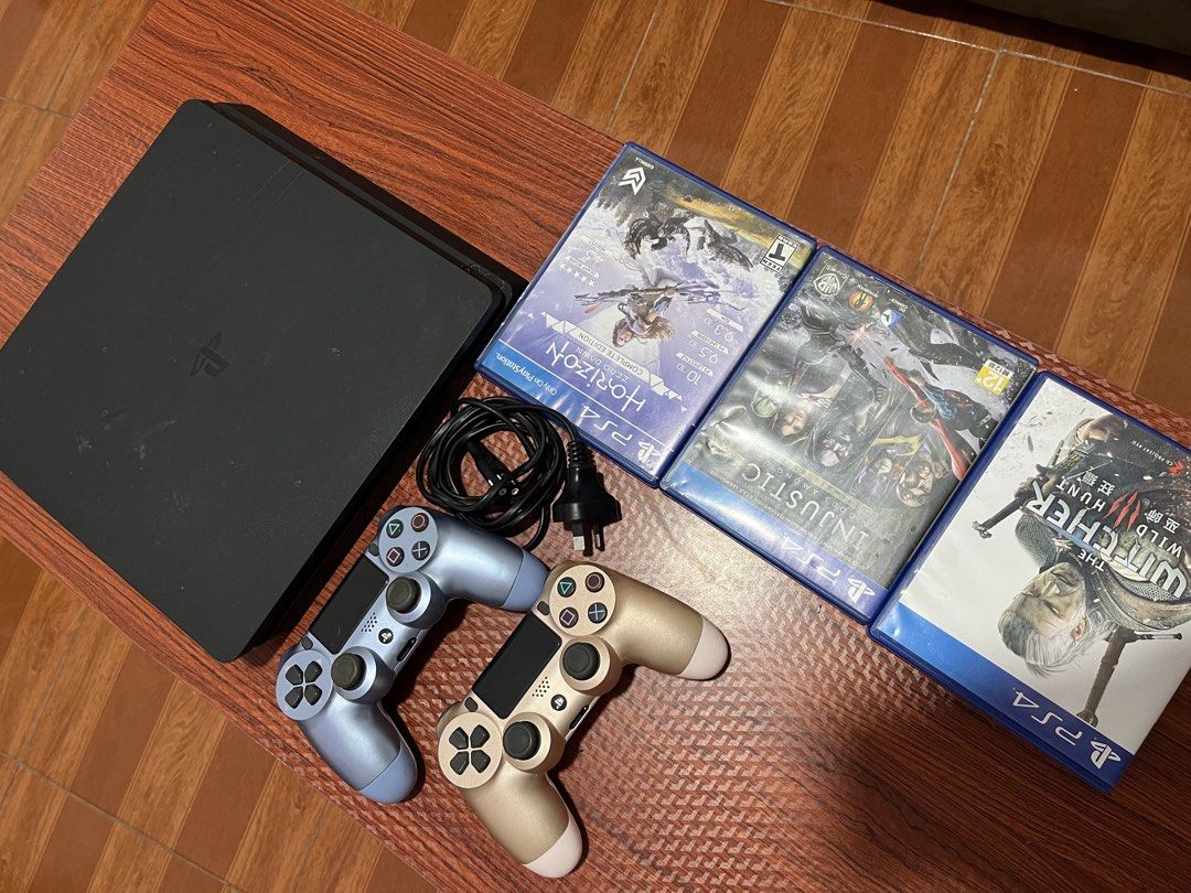 PS4 Console with 2 Controllers and 3 Games (Category: PlayStation) located in Manila. Submitted by classiqueph (Listing ID 1452815777, Image 2). Description: - PlayStation 4 slim -500gb - Two DualShock 4 Controllers (1 Gold, 1 Blue) - Three Games Included: - Horizon Zero Dawn Complete Edition - Injustice 2 - The Witcher 3: Wild Hunt - All necessary cables included - Ready for immediate gaming!.