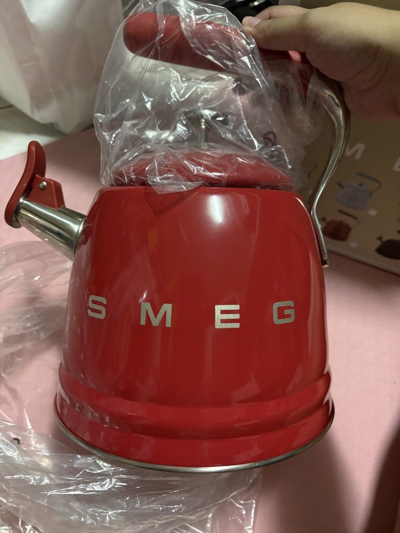 Red SMEG Kettle (Category: Kettles & Airpots) located in San Juan City. Submitted by claricecaswell22 (Listing ID 1452820524, Image 3). Description: - Red SMEG kettle - Brand new, still in original plastic packaging - Minor paint chips on the side (visible in the last photo) - A stylish addition to any kitchen.