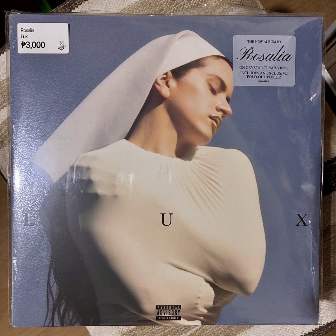 Rosalia - Lux Vinyl (Category: Vinyls) located in Quezon City. Submitted by sashaspinsss (Listing ID 1452700276, Image 1). Description: - Brand New Rosalia Album: 'Lux' - Format: Crystal Clear Vinyl - Exclusive Inclusion: Fold-out Poster - Parental Advisory: Explicit Content sticker visible - Price: P3,000.