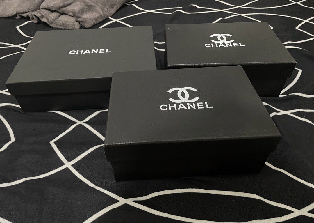 Set of 3 Chanel Gift Boxes (Category: Luxury Accessories) located in Guiguinto. Submitted by beatan13 (Listing ID 1452819688, Image 2). Description: - Set of 3 Chanel gift boxes - Classic black with iconic Chanel logo - Ideal for storing small items or enhancing gift presentations.