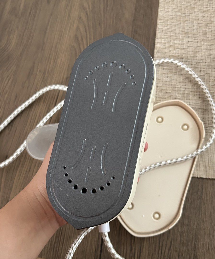 Simplus Portable Mini Steam Iron with Water Cup (Category: Irons & Steamers) located in Makati City. Submitted by michellecollado07 (Listing ID 1452794661, Image 2). Description: - Compact Simplus steam iron - Ideal for travel and quick touch-ups - Includes a small water cup - Comes with a European plug - Soleplate with steam vents for effective steaming - Easy to store and use - Keep your clothes looking neat anywhere.