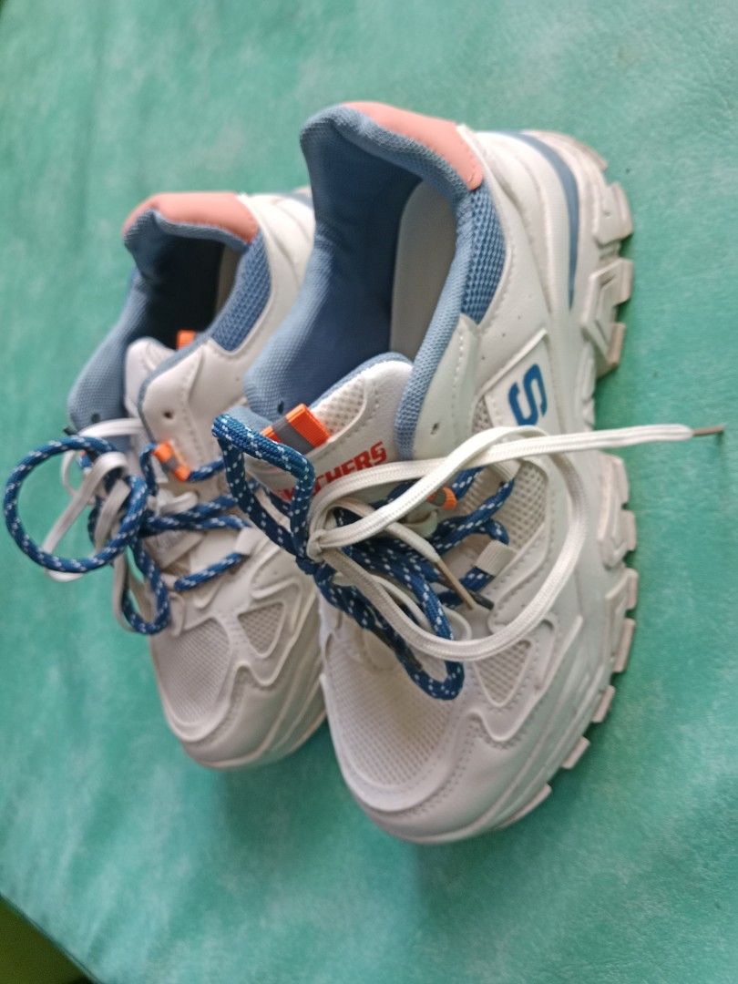 Skechers White Blue Chunky Sneakers (Category: Sneakers) located in Manila. Submitted by narsonlineexpression (Listing ID 1452712469, Image 2). Description: - White chunky sneakers - Blue and orange accents - Lace-up closure - Thick soles - Comfortable for everyday wear - Stylish design.
