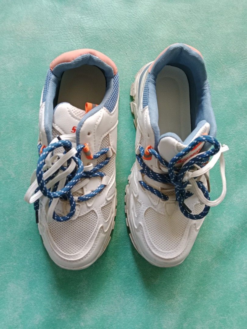 Skechers White Blue Chunky Sneakers (Category: Sneakers) located in Manila. Submitted by narsonlineexpression (Listing ID 1452712469, Image 1). Description: - White chunky sneakers - Blue and orange accents - Lace-up closure - Thick soles - Comfortable for everyday wear - Stylish design.