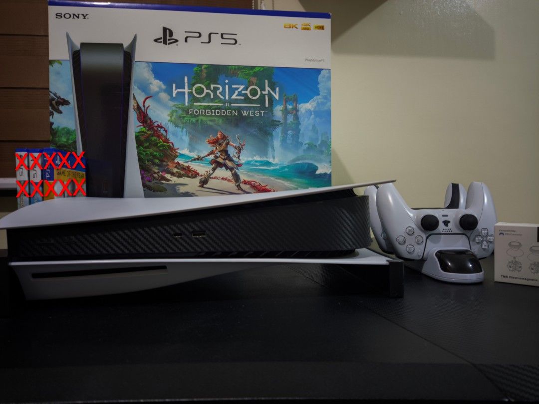 Sony PlayStation 5 (PS5) (Category: PlayStation) located in Bulacan. Submitted by jcswish (Listing ID 1400519802, Image 3). Description: AUTO PASS ON BUY AND SELLERS. PASS ON LOW BALL OFFERS PS5 Phat Comes with : 2 controllers (1 stock color, 1 all white color) 3 games - Red Dead Redemption 2, Star Wars Outlaws, Harvest Moon : The Winds Of Anthos 1 pc black horizontal stand 1 pc dobe dualshock charging dock 1 pair of brand new Gulikit TMR Joystic