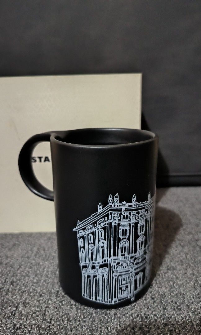Starbucks Reserve Roastery Mug with SKU (Category: Coffee & Tea Tableware) located in Bulacan. Submitted by tripledouble532 (Listing ID 1452839544, Image 2). Description: Here's what makes it special: Collection: Starbucks Reserve Roastery Location: Milan (Milano), Italy Design: Matte black finish with a white illustration of the Colosseum and "Starbucks Reserve Roastery Milano" branding. Availability: Sold exclusively at the Starbucks Reserve Ro