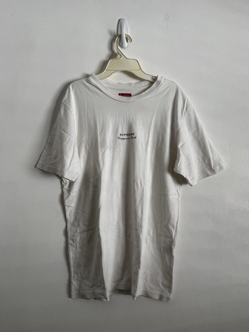 Supreme Compagnie de Qualité T-shirt White (Category: Tshirts & Polo Shirts ) located in Pasig City. Submitted by archive.project (Listing ID 1452772041, Image 1). Description: - White Supreme T-shirt - Features 'Compagnie de Qualité' text on the front - Minor flaw: small hole near the back tag - Perfect for everyday casual outfits 600 only.