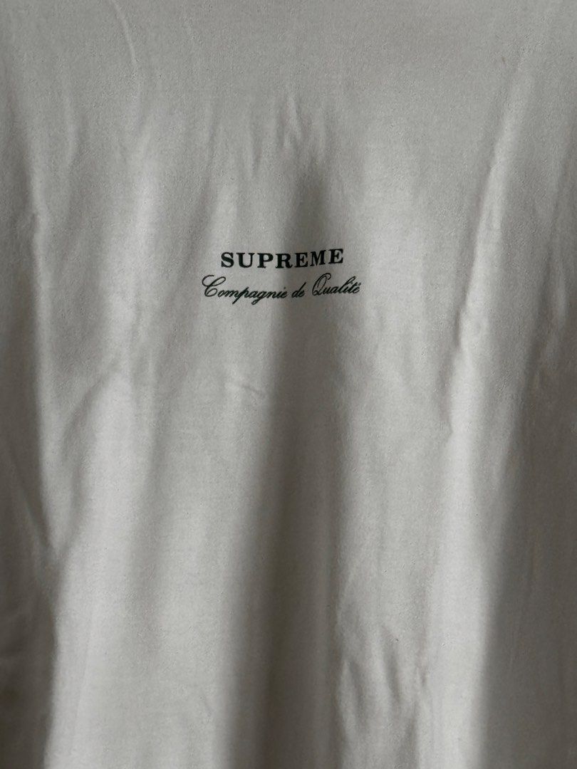 Supreme Compagnie de Qualité T-shirt White (Category: Tshirts & Polo Shirts ) located in Pasig City. Submitted by archive.project (Listing ID 1452772041, Image 2). Description: - White Supreme T-shirt - Features 'Compagnie de Qualité' text on the front - Minor flaw: small hole near the back tag - Perfect for everyday casual outfits 600 only.