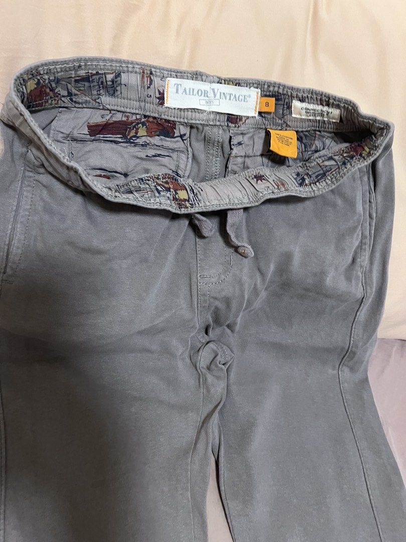 Tailor Vintage Grey Jogger Pants Size 8 (Category: Babies & Kids Fashion) located in Makati City. Submitted by aja4817 (Listing ID 1452708381, Image 2). Description: - Grey jogger pants by Tailor Vintage - Elastic waistband with drawstring for a perfect fit - Cuffed ankles for a modern look - Two button pockets on the back - Unique patterned inner lining - Ideal for casual wear.