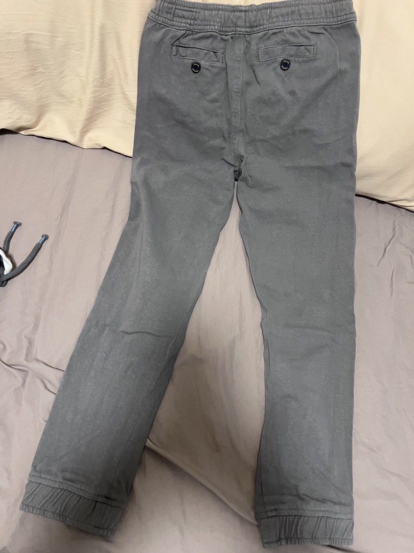 Tailor Vintage Grey Jogger Pants Size 8 (Category: Babies & Kids Fashion) located in Makati City. Submitted by aja4817 (Listing ID 1452708381, Image 3). Description: - Grey jogger pants by Tailor Vintage - Elastic waistband with drawstring for a perfect fit - Cuffed ankles for a modern look - Two button pockets on the back - Unique patterned inner lining - Ideal for casual wear.