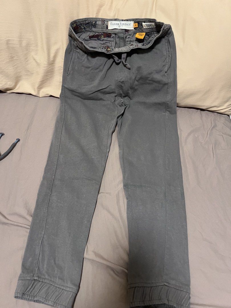 Tailor Vintage Grey Jogger Pants Size 8 (Category: Babies & Kids Fashion) located in Makati City. Submitted by aja4817 (Listing ID 1452708381, Image 1). Description: - Grey jogger pants by Tailor Vintage - Elastic waistband with drawstring for a perfect fit - Cuffed ankles for a modern look - Two button pockets on the back - Unique patterned inner lining - Ideal for casual wear.