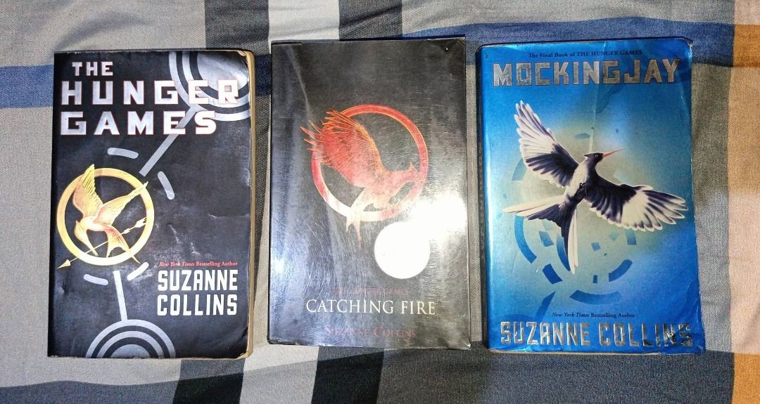 The Hunger Games Trilogy by Suzanne Collins (Category: Storybooks) located in Manila. Submitted by itsmedannnie (Listing ID 1452758032, Image 1). Description: - Complete Hunger Games Trilogy - Includes: The Hunger Games, Catching Fire, Mockingjay - Author: Suzanne Collins - Perfect for fans of the series - Gripping and exciting read.