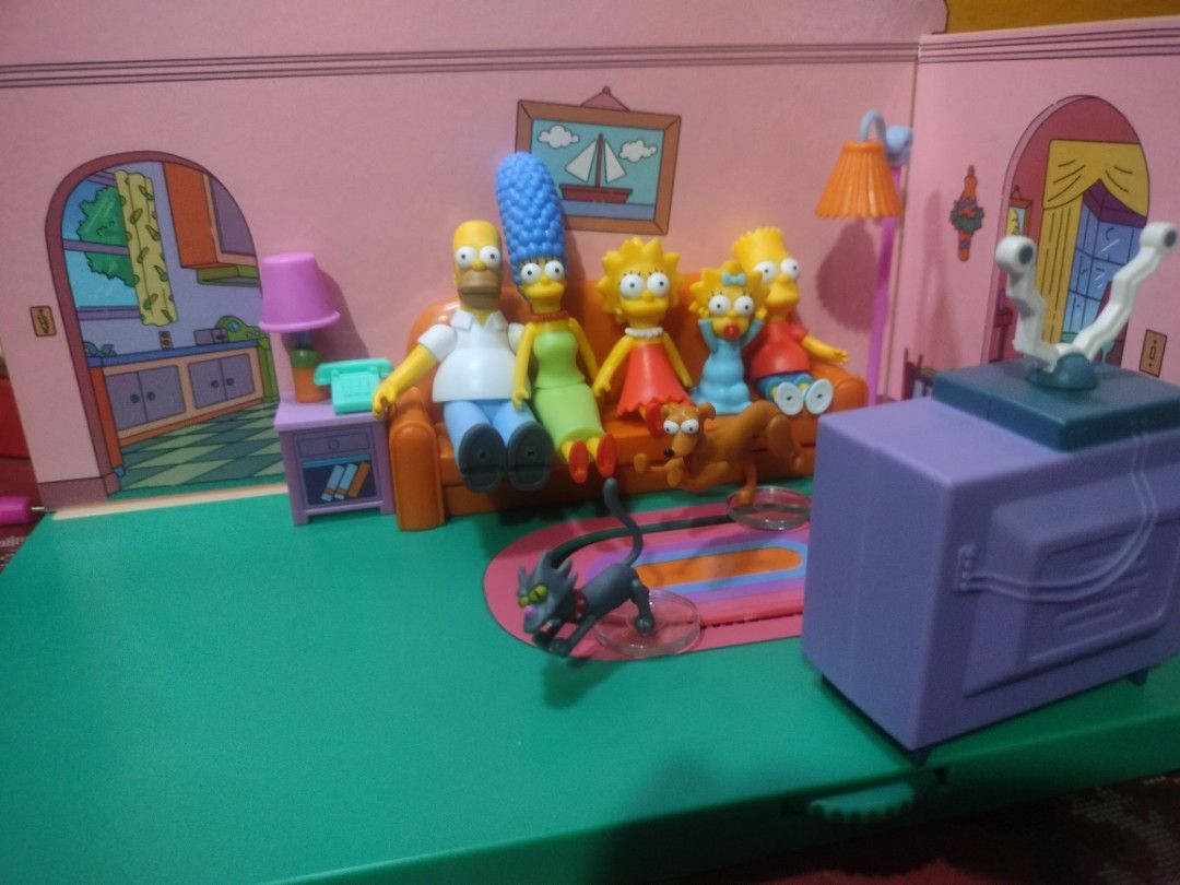 THE SIMPSON COMPLETE SET (Category: Figurines & Statues) located in Iloilo. Submitted by midori_toys (Listing ID 1452803607, Image 1). Description: - JAKKS - Complete set of The Simpsons family figures: Homer, Marge, Bart, Lisa, and Maggie. - Includes beloved pets: Santa's Little Helper and Snowball II. - Ideal for any dedicated Simpsons fan or collector. - Separate box set - Hard to find as set.