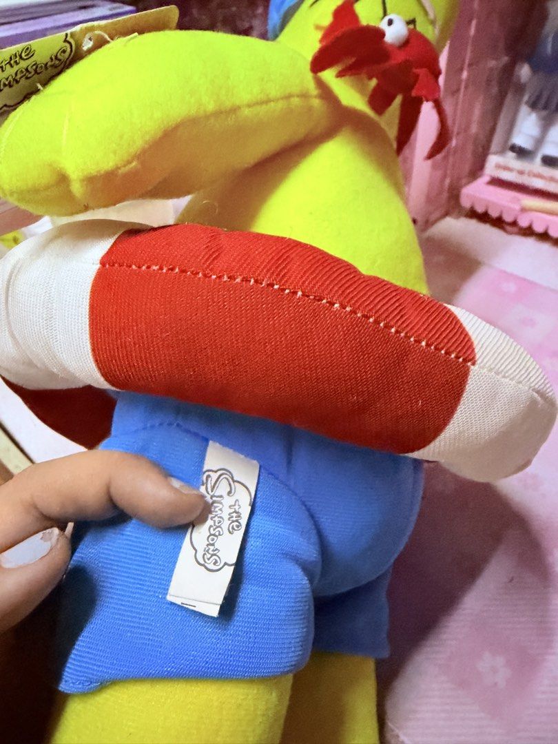 The Simpsons Homer Simpson Beach Plush Toy (Category: Plushies & Soft Toys) located in Caloocan City. Submitted by fluffy.stuff10 (Listing ID 1452838231, Image 3). Description: - Homer Simpson plush toy ready for a beach adventure! - Dressed in swim trunks and flip-flops. - Includes a lifebuoy accessory. - Features a small crab attached to his back. - Original 'The Simpsons' tag included. - A must-have collectible for any Simpsons fan!.
