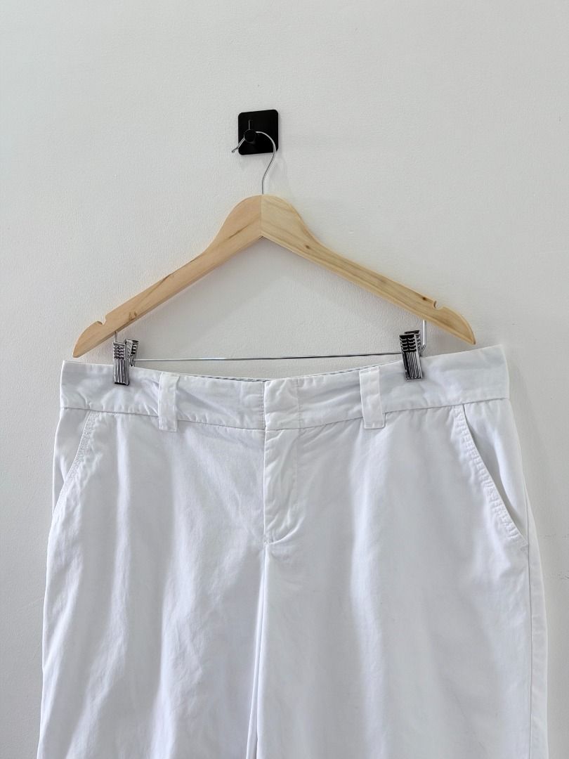 Tommy Hilfiger White Chino shorts (Category: Shorts) located in Cabanatuan. Submitted by argarments.ph (Listing ID 1452708319, Image 2). Description: Tagged: Size 14 Waist 36" | Length 20.5" | Leg opening 11.5" | Thigh 12.5" | Rise 12" Condition: Excellent Issue(s): Dot stain (unnoticeable).
